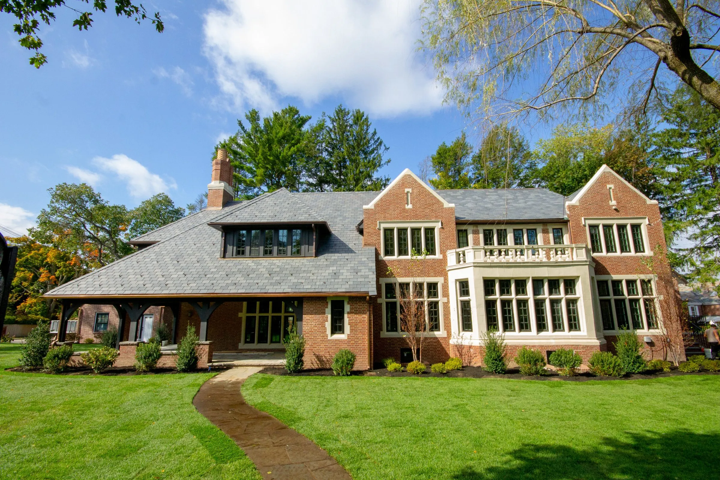 Restored brick Tudor home with slate roof